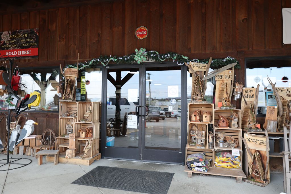 Yoder's Country Market has a rustic store entrance with wooden decor