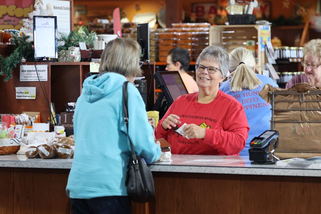 Customer at a retail checkout counter.