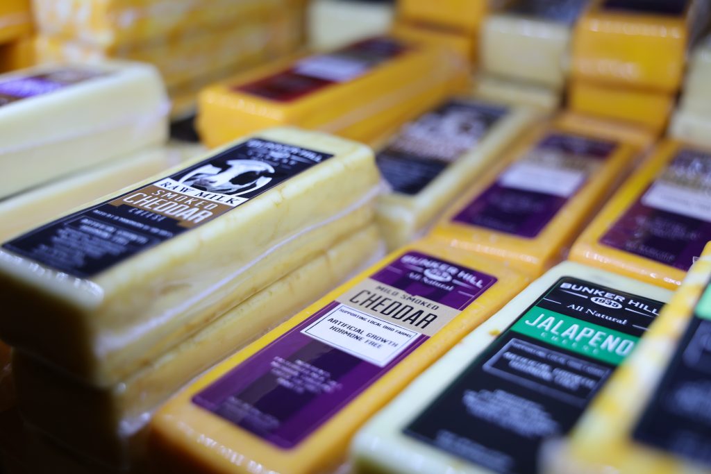 Various types of packaged cheese blocks