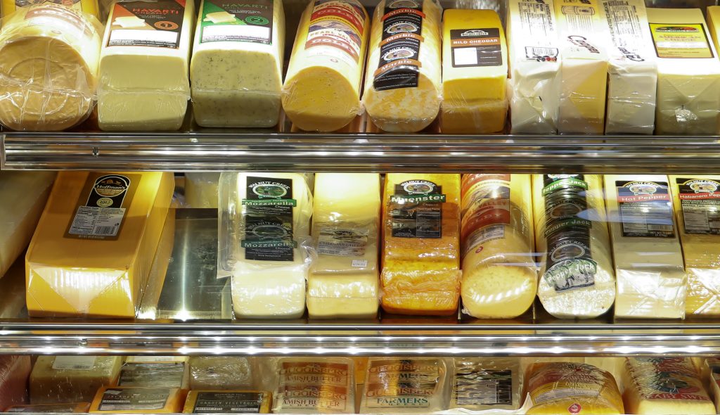 Assorted cheeses in the deli cooler at Yoder's Country Market