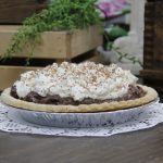 Chocolate pie with whipped topping and fine chocolate shavings