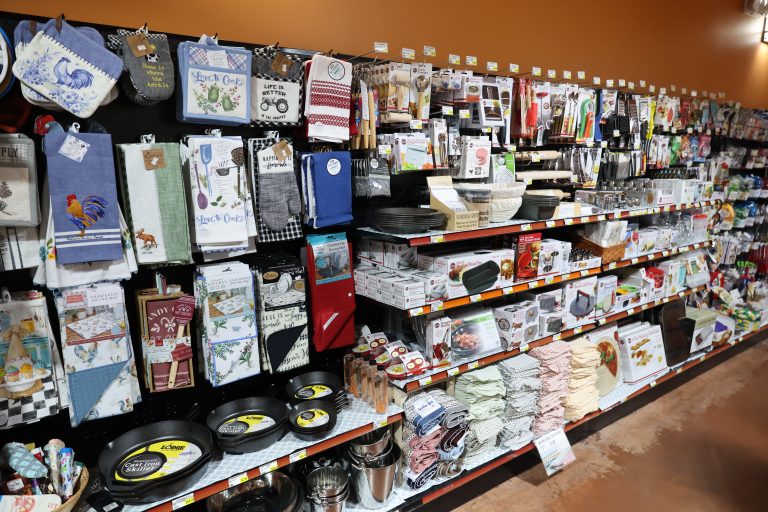 Dish towels, hot mats, skillets, and more line the store shelves.
