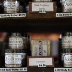 Shelves stocked with body budder made with goat milk