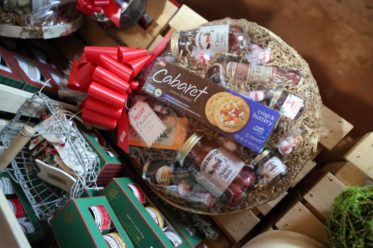 A neatly arranged gift basket is arranged for the holiday season